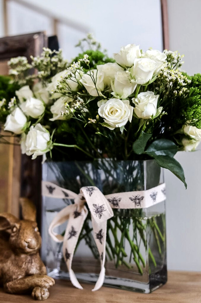 white rose arrangement in glass vase