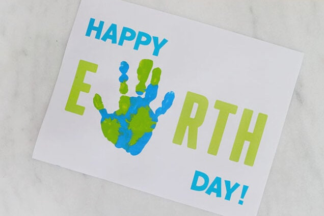 Handprint pressed onto Earth Day paper