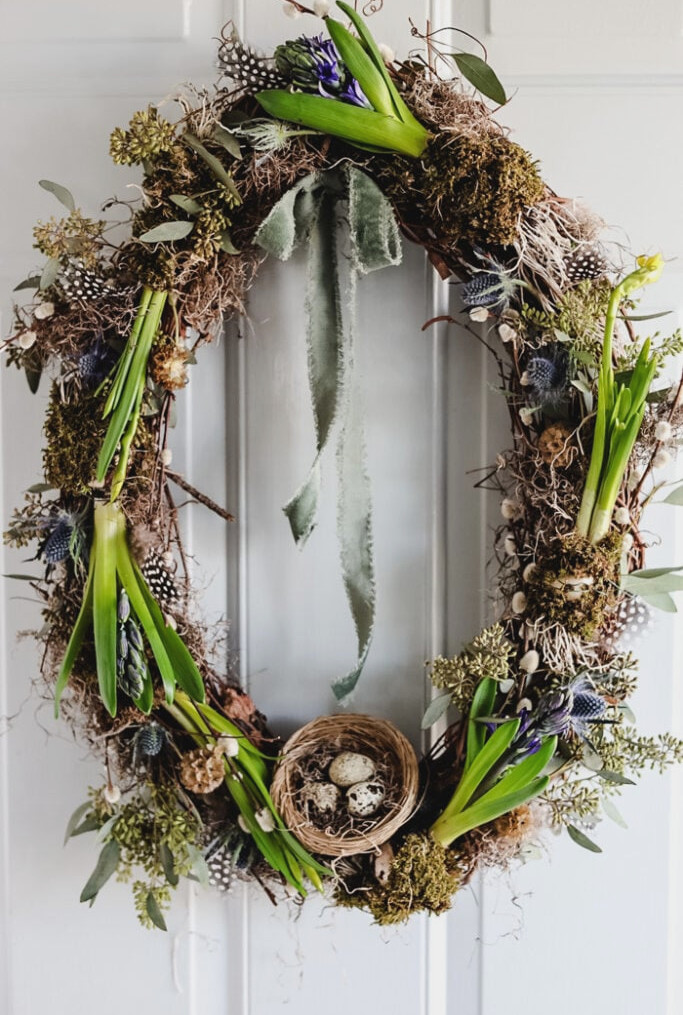 spring wreath with fresh flowers and bulbs