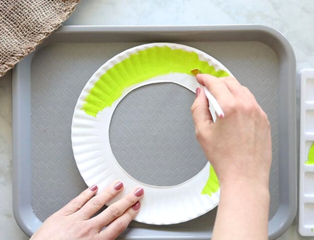 Painting a Paper Plate Green