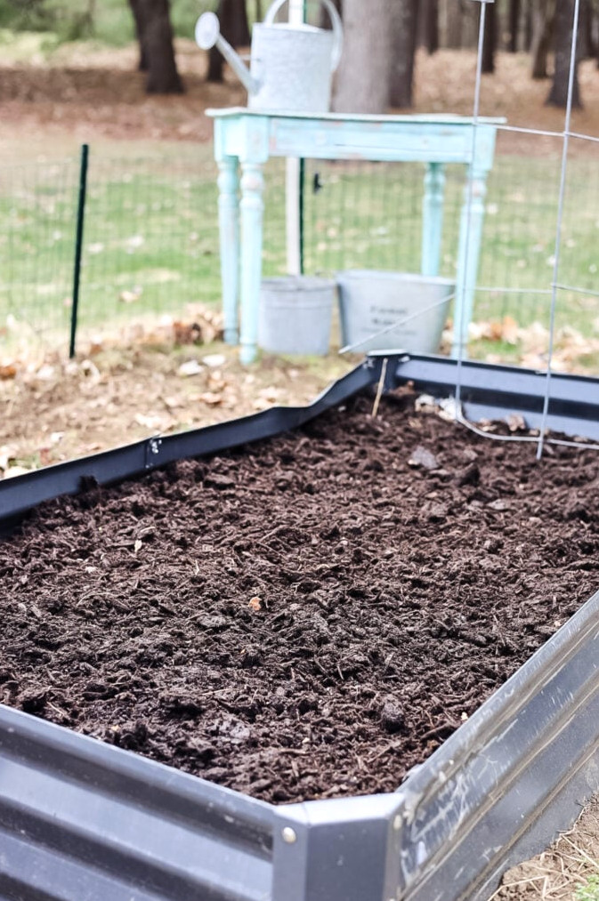 a raised bed filled with soil but not plants