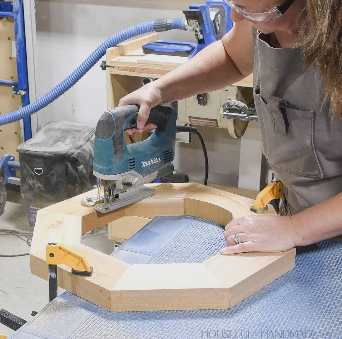 Using a jigsaw to cut the circular center from the octagon.