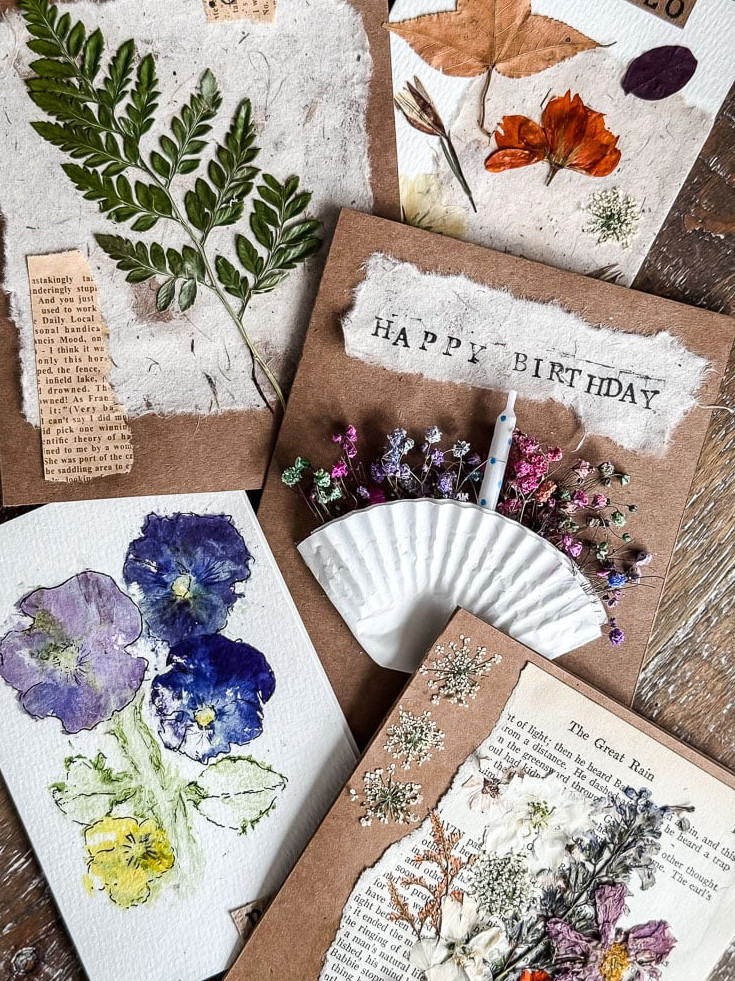 5 handmade cards with different flowers and designs on them