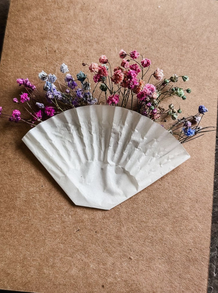 colorful baby's breath in a cupcake liner on the front of a card
