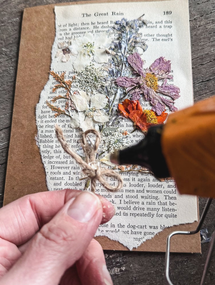 hot gluing a piece of jute twine