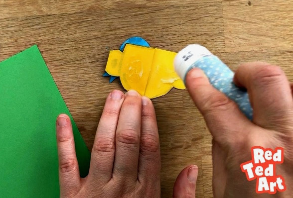 gluing a paper trophy to the card