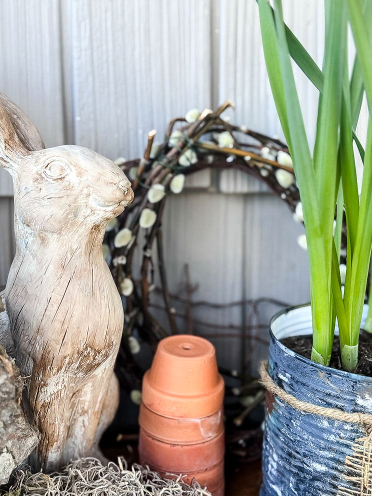 spring display with bunny, wreath, and pot of tulips