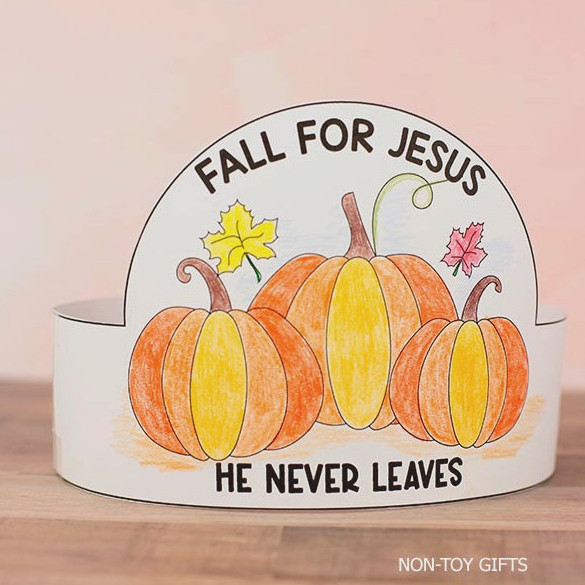 Kids wearing a colorful Christian fall pumpkin headband craft with pumpkins and a faith-based autumn message.