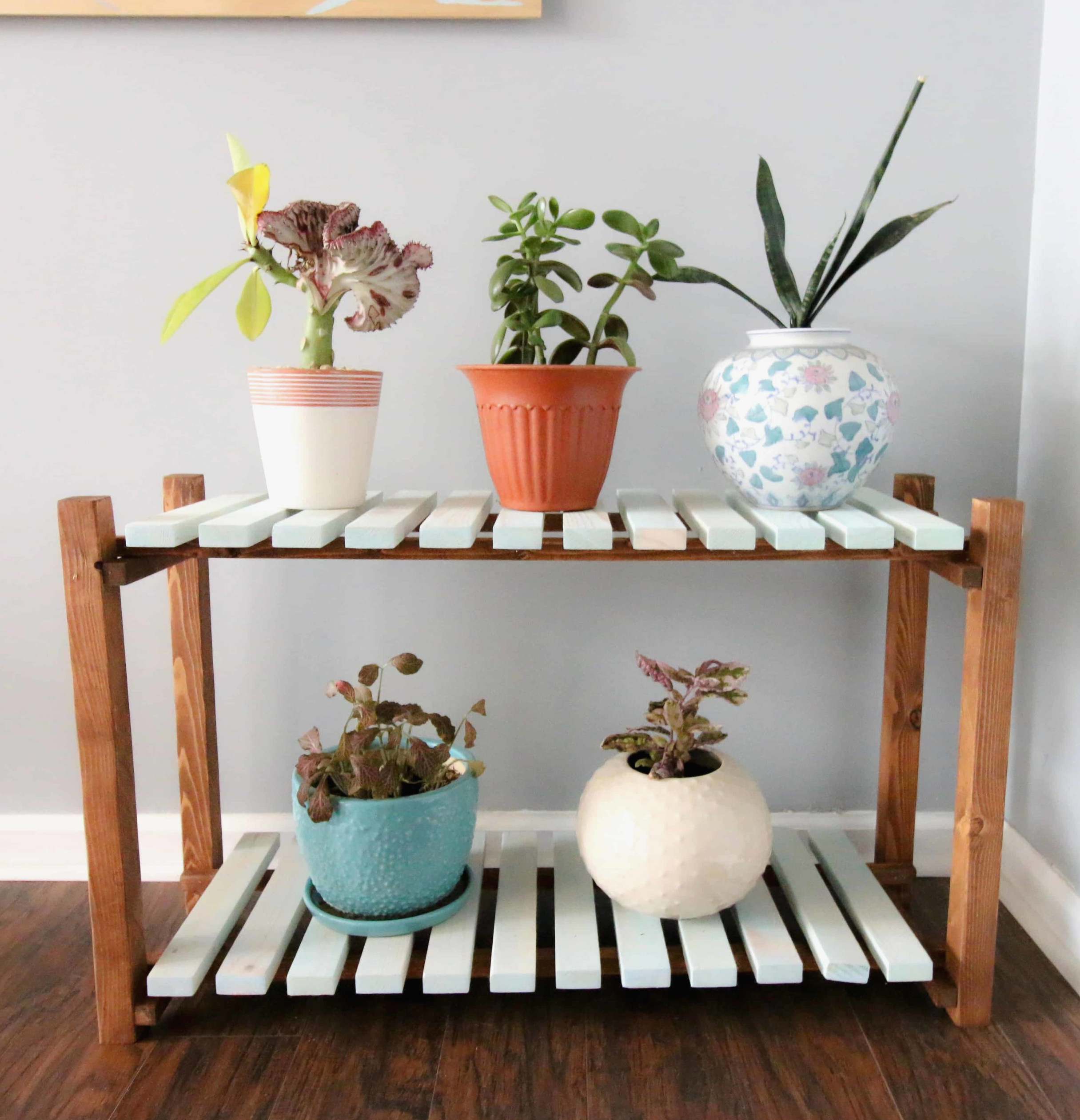 DIY slatted plant stand using scrap wood