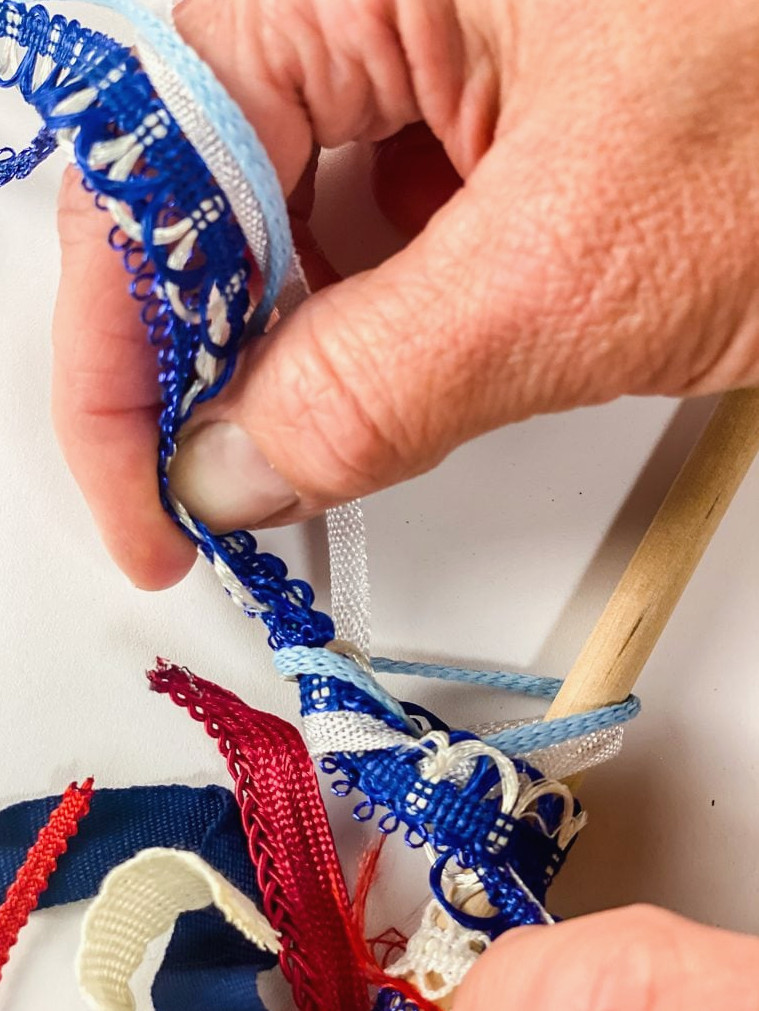tying ribbon to a dowel