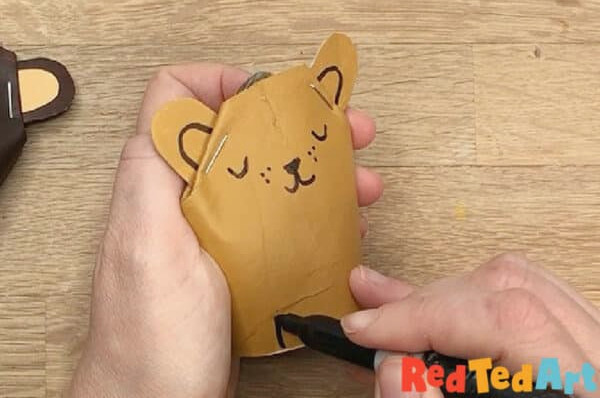 Staple ear in place and draw bear features