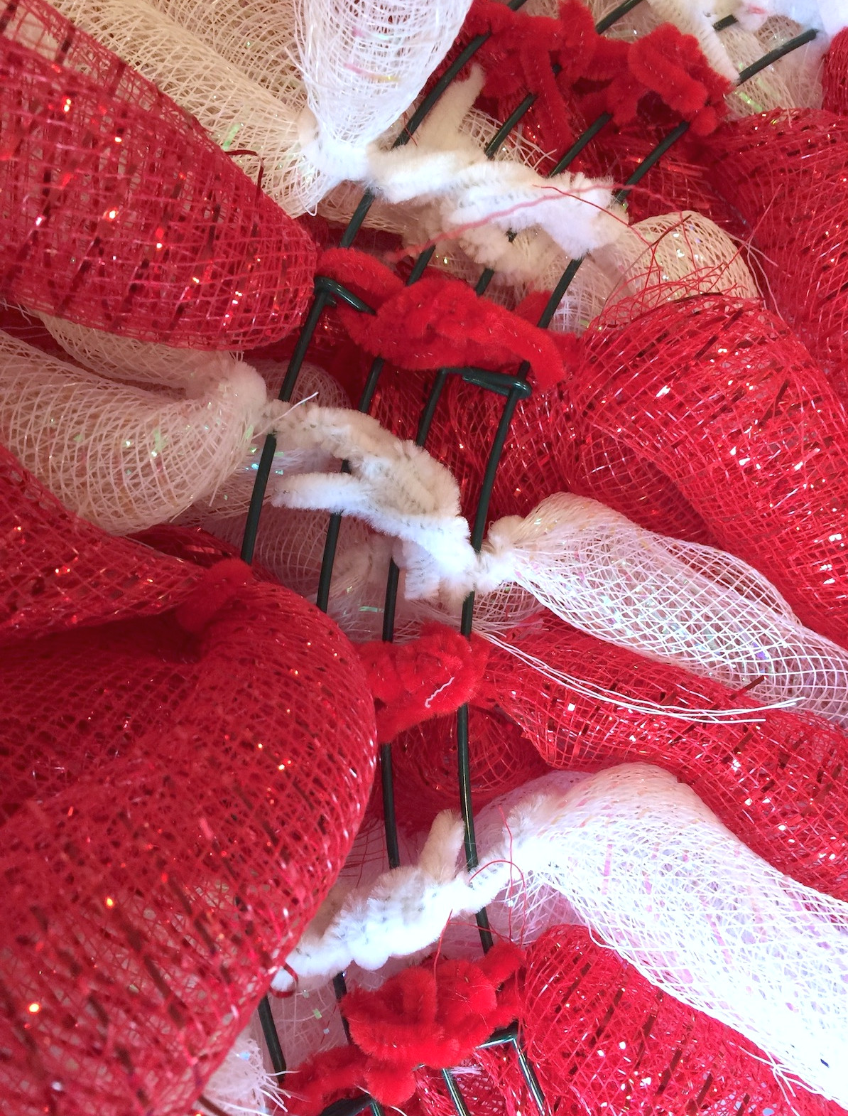Pipe cleaners secured on the back of the wreath