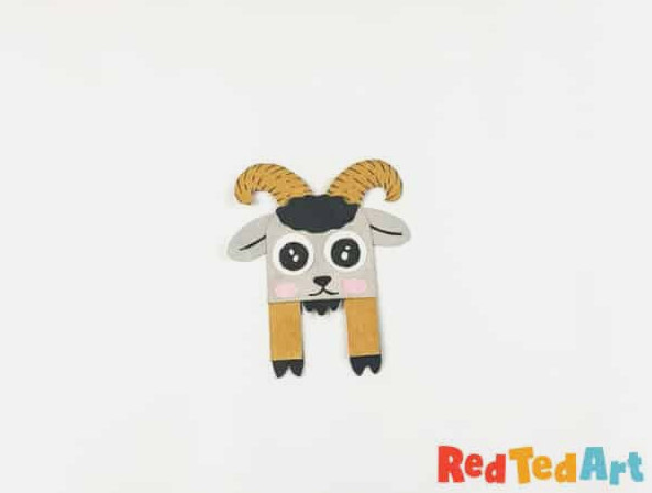 fasten the hugging legs onto the goat’s head