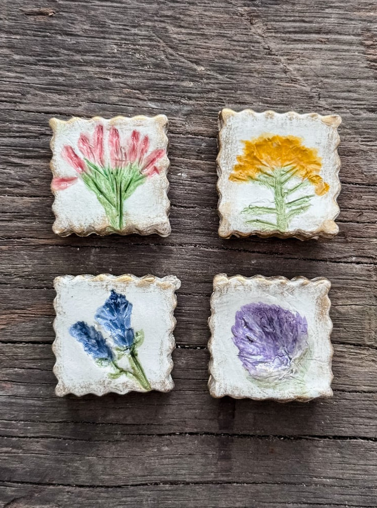 4 clay magnets with flowers painted