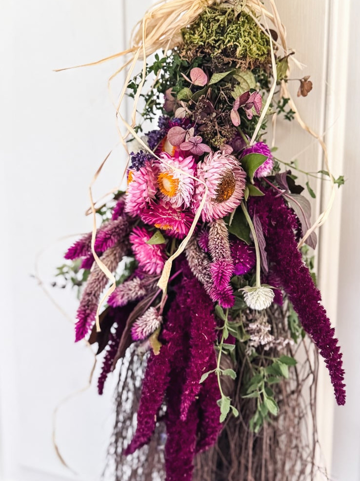 a cinnamon broom decorated with flowers