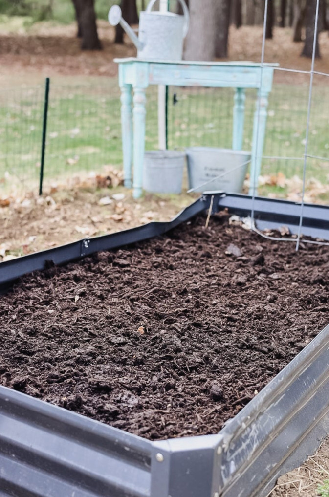 a raised bed filled with soil but not plants