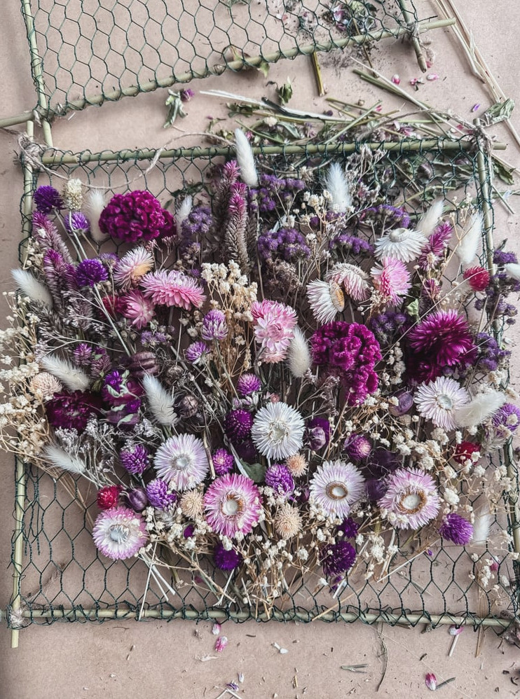 a frame filled with dried flowers