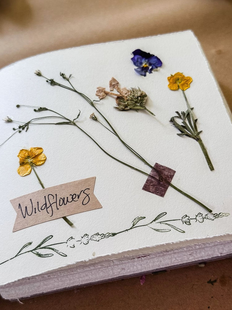 pressed blooms inside a journal